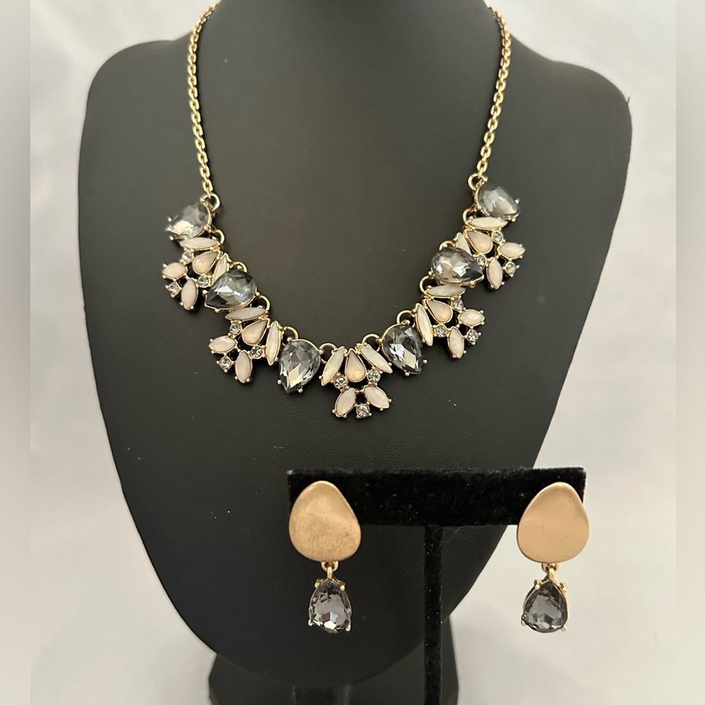 Gold tone necklace and post earrings set with grey and blue rhinestones